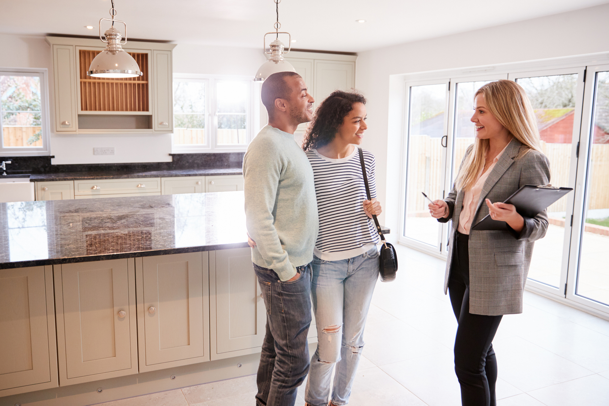 Couple discussing a home with a realtor